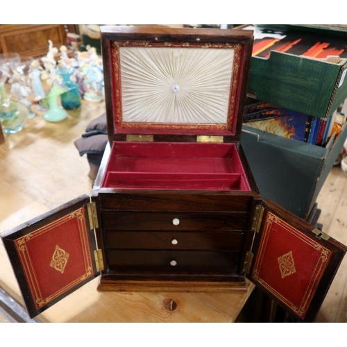 261 - A 19th century rosewood table top cabinet, with inlaid mother of pearl decoration, the hinged top op... 