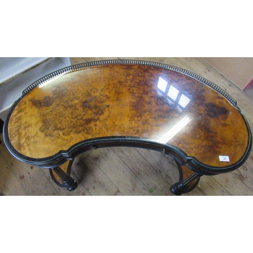 29 - A 19th century Gillows & Co amboyna kidney shaped writing table, with galleried back, the drawer sta... 