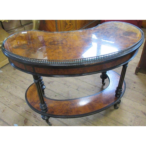 29 - A 19th century Gillows & Co amboyna kidney shaped writing table, with galleried back, the drawer sta... 