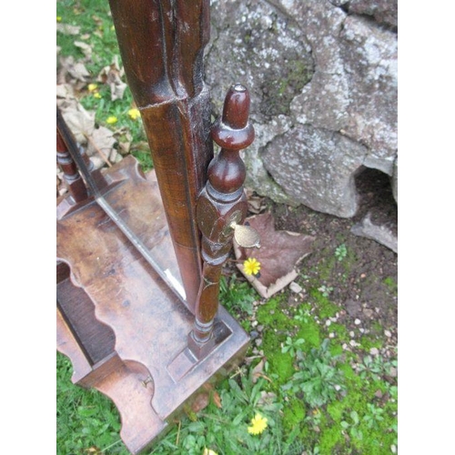 35 - An early 18th century design walnut toilet mirror, with stepped base fitted with three short and one... 