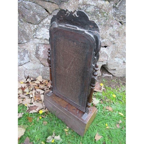 35 - An early 18th century design walnut toilet mirror, with stepped base fitted with three short and one... 