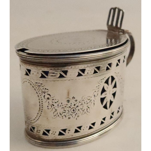 353 - A Georgian silver oval mustard pot, with pierced and bright cut decoration, repair to lid, with blue... 