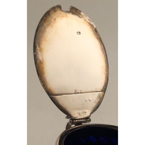 353 - A Georgian silver oval mustard pot, with pierced and bright cut decoration, repair to lid, with blue... 