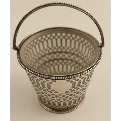 354 - A pierced silver pot, with frosted glass liner and swing handle, London 1816, height including handl... 