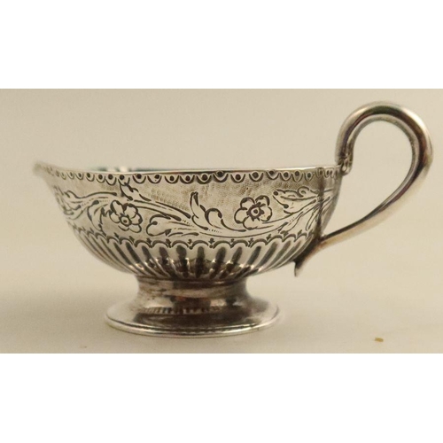 355 - A Georgian silver cream jug, of baluster form, the body embossed with scrolls, a hound and a bird, m... 