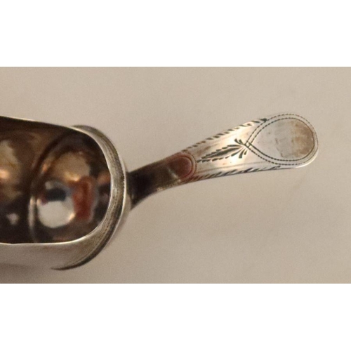 357 - A Georgian silver caddy spoon, of shovel form, with bright cut decoration, London 1739, together wit... 