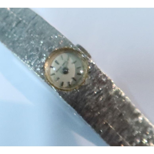 374 - A 9ct white gold Beuche Girod Swiss lady's watch, dial with baton numerals, approximately 8mm diamet... 