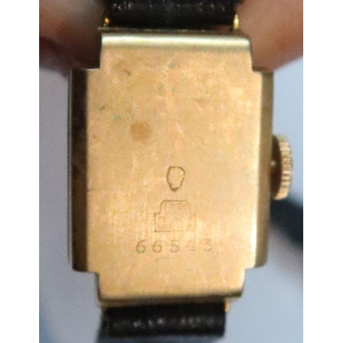 375 - An 18k gold case lady's wrist watch, on leather strap, together with a 9k gold cased lady's watch, o... 