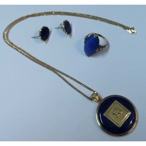 384 - A 14k gold and lapis lazuli pendant, on 14k fine link chain together with a lapis lazuli ring and a ... 