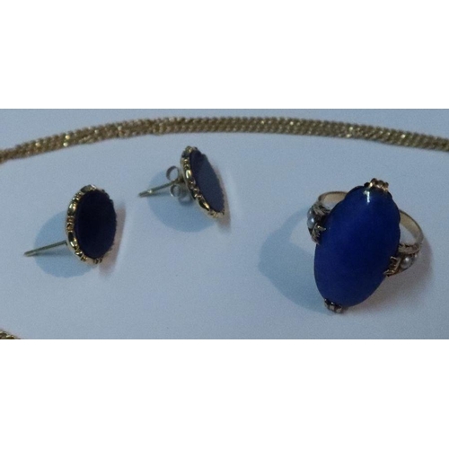 384 - A 14k gold and lapis lazuli pendant, on 14k fine link chain together with a lapis lazuli ring and a ... 