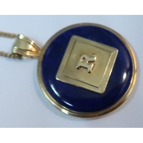 384 - A 14k gold and lapis lazuli pendant, on 14k fine link chain together with a lapis lazuli ring and a ... 