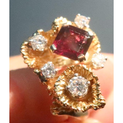 387 - A 14k garnet and diamond dress ring, 13.1g