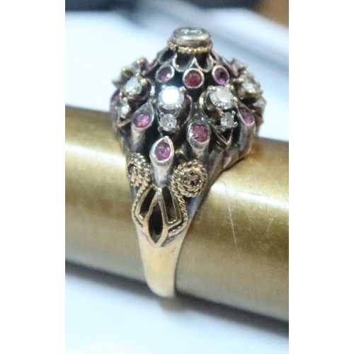 391 - A gold ring set with three blue stones, together with an antique style ruby and diamond ring