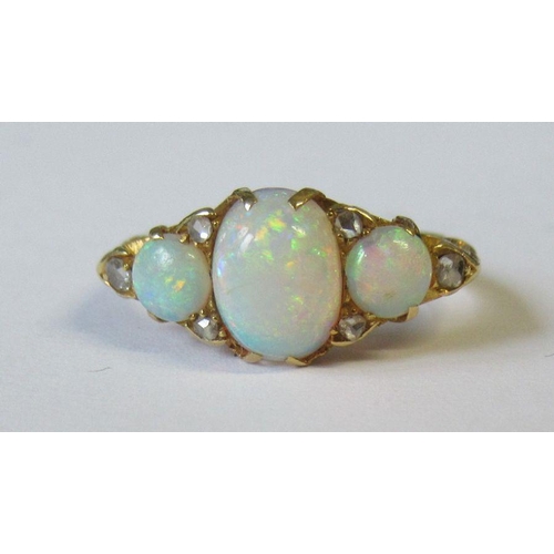 408 - An 18ct three stone opal ring with diamond accents, 3.9g