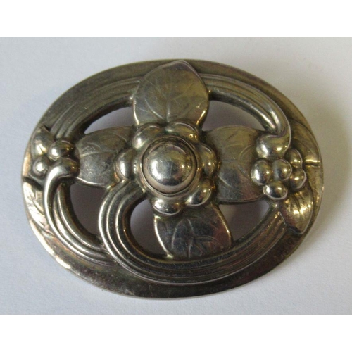 411 - A Georg Jensen brooch, with stylised flower, no. 138