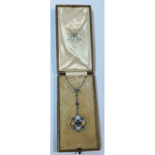 424 - An Edwardian moonstone, diamond and sapphire pendant, in fitted leather case for Goldsmiths and Silv... 