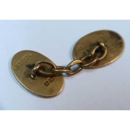 427 - A pair of 18ct gold cufflinks, engraved with a monogram