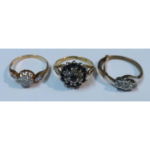 429 - An Antique diamond cluster ring, together with a sapphire and diamond cluster ring and a three stone... 