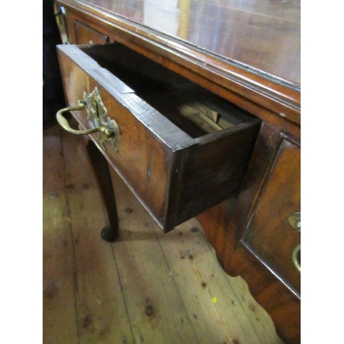 43 - An 18th century walnut lowboy, with rebated top, fitted with three drawers to frieze, raised on turn... 