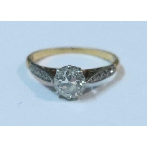 433 - An 18ct gold and platinum diamond ring, claw set old cut diamond of approximate 0.75ct, with four gr... 