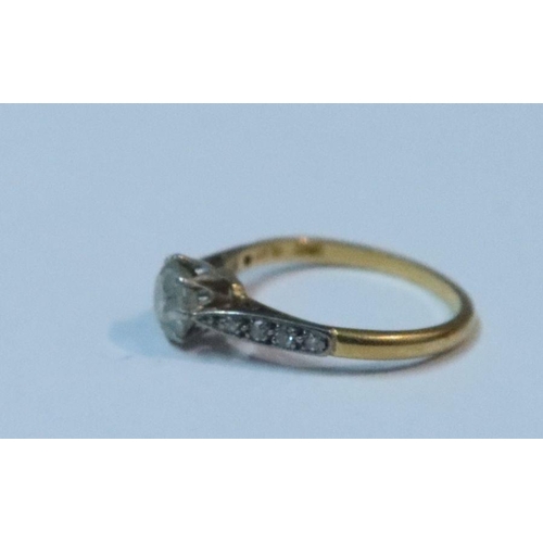 433 - An 18ct gold and platinum diamond ring, claw set old cut diamond of approximate 0.75ct, with four gr... 