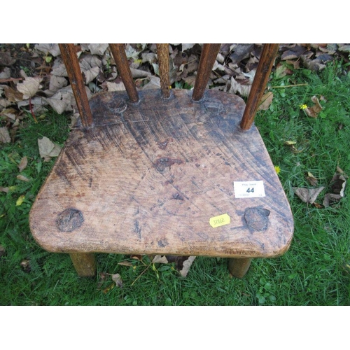 44 - A child’s primitive stick back chair