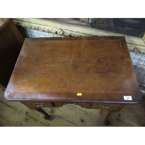 46 - An 18th century walnut low boy, quarter veneer with cross banded top, fitted three drawers to frieze... 