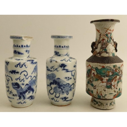 474 - A pair of Chinese blue and white vases, decorated with mythical beasts, with four character marks to... 