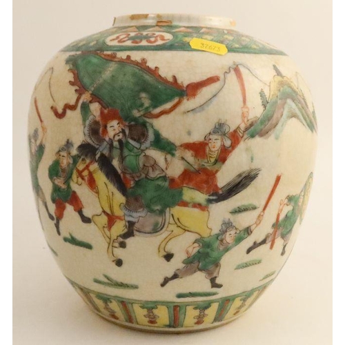 479 - A late 19th century/early 20th century famille rose ginger jar, decorated with warriors on horseback... 