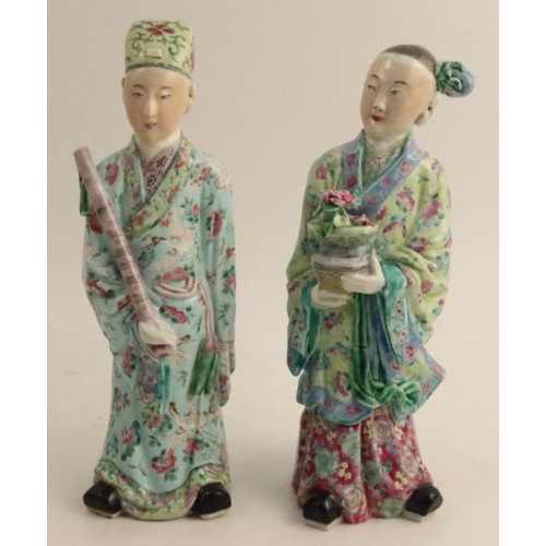 487 - A pair of late 19th century/early 20th century Chinese porcelain figures, modelled as dignitaries in... 