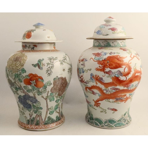 493 - Two Chinese baluster vases and covers, one decorated with three claw dragons, another with birds and... 