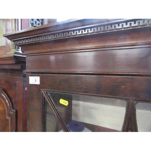 5 - A 19th century narrow bookcase with astragal glazed bars opening to revea l shelves raised on bracke... 