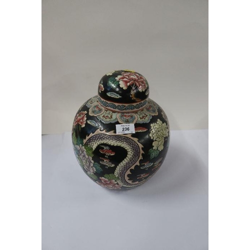 501 - A pair of Oriental covered ginger jars, decorated with dragons and flowers to a black ground, height... 