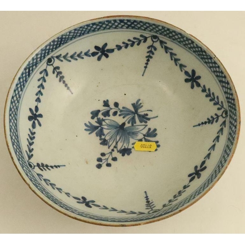 507 - Two blue and white Delft bowls, decorated with landscapes and foliage