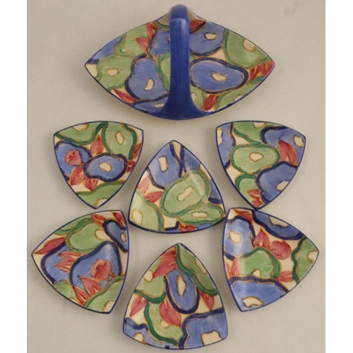 509 - A Clarice Cliff Blue Chintz pattern basket and six dishes, of triangular shape -- All pieces are in ... 