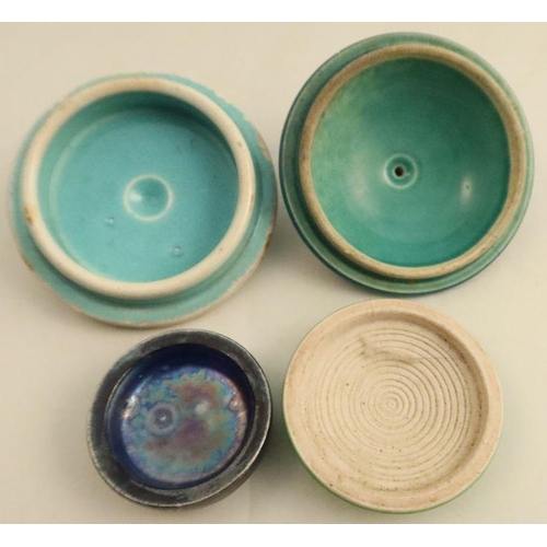 528 - Three Ruskin pottery cabochon plaques, unmounted, together with four pot lids