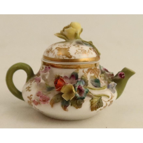 532 - A Continental porcelain miniature tea pot, encrusted with flowers, cross swords mark to base, height... 