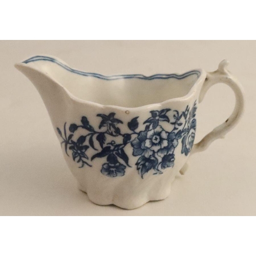 533 - A late 18th/early 19th century moulded cream jug, decorated with blue flowers, height 2.75ins, width... 