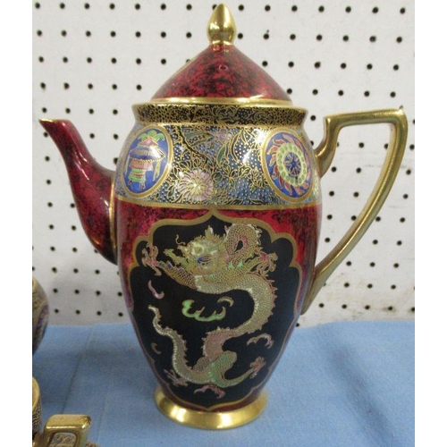 537 - A Carlton Ware Stoke on Trent coffee set, comprising coffee pot, milk jug, sugar bowl, six cups and ... 