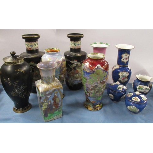 543 - A collection of Carlton Ware vases, and a pair of covered pots, all decorated in various patterns, (... 