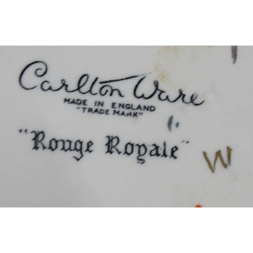 553 - A collection of Carlton Ware, to include plates, a covered barrel, vases, some pieces in Rouge Royal... 