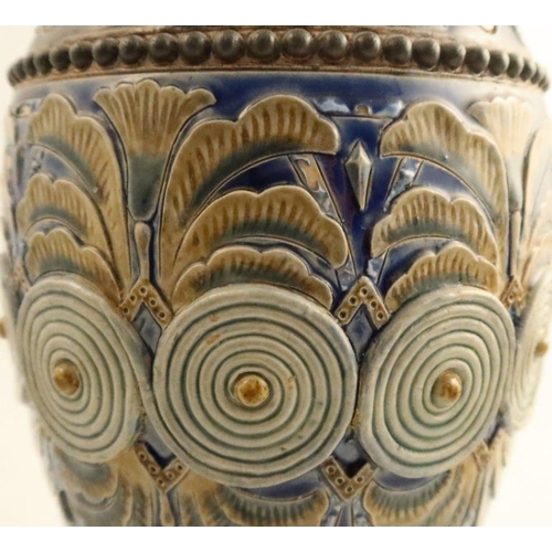 555 - A 19th century Doulton Lambeth stoneware vase, relief decorated with leaves and swirls, dated 1885, ... 