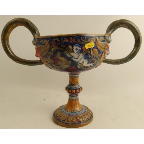 558 - A Cantagalli style pottery two handled pedestal cup, the interior decorated with putti picking apple... 