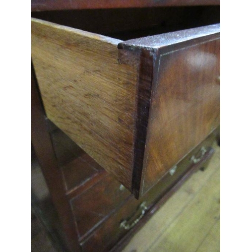 56 - An 18th century mahogany bachelors chest, having four long drawers and a cross banded top below a br... 