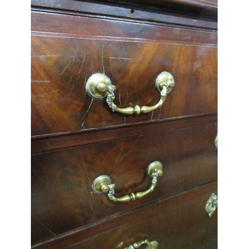 56 - An 18th century mahogany bachelors chest, having four long drawers and a cross banded top below a br... 