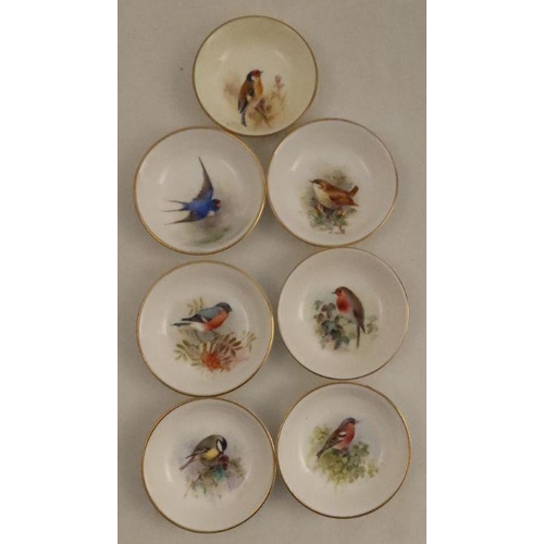 568 - Seven Royal Worcester small dishes, decorated with a English birds, five by Powell, one by Barker an... 