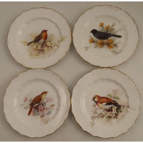 574 - Four Royal Worcester small plates, decorated with a Nightingale, a Hawfluck, a Robin and a Blackbird... 