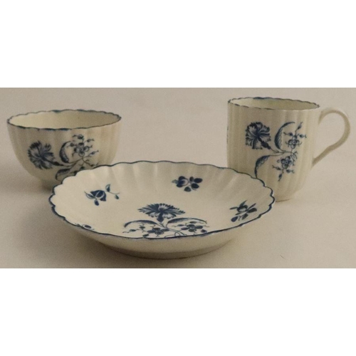 591 - A Worcester fluted cup, tea bowl and saucer, painted in underglaze blue with the Carnation pattern