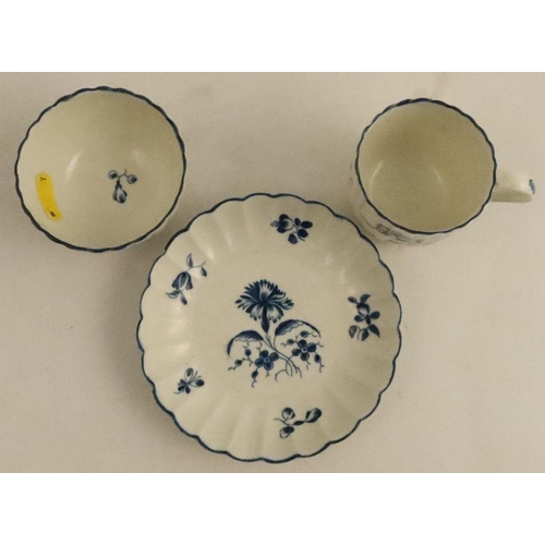 591 - A Worcester fluted cup, tea bowl and saucer, painted in underglaze blue with the Carnation pattern