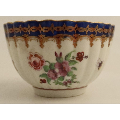 635 - A Worcester fluted tea bowl and saucer decorated with landscape panels, possibly by O'Neil, to blue ... 